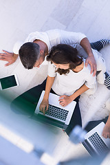 Image showing couple using tablet and laptop computers top view