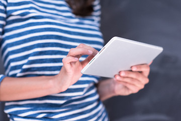 Image showing woman using tablet  in front of chalk drawing board