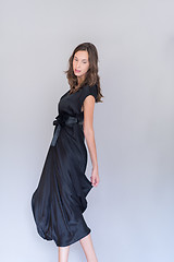 Image showing woman in a black dress isolated on white background