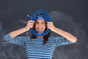 Image showing woman holding a internet cable in front of chalk drawing board