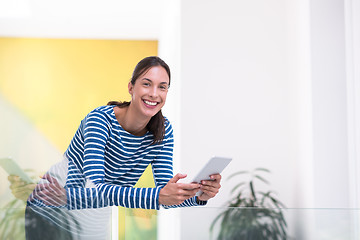 Image showing young woman at home websurfing