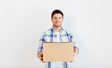 Image showing happy man holding cardboard box