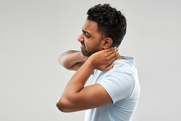 Image showing unhealthy indian man suffering from neck pain