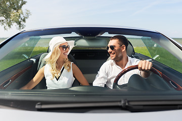 Image showing happy man and woman driving in cabriolet car