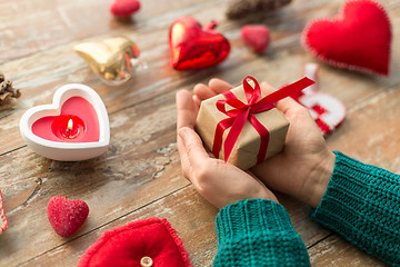 Image showing close up of hands holding christmas gift