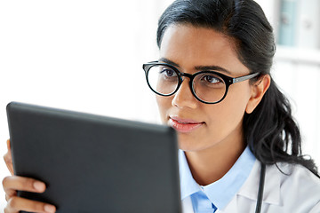 Image showing close up of female doctor with tablet computer