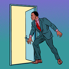 Image showing African man opens the door