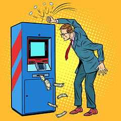 Image showing the damaged ATM and the angry man