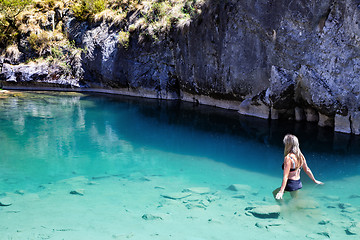 Image showing Woman enjoying the cool blue waters of the limestone caves