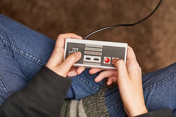 Image showing Playing an old gaming console