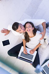 Image showing couple using tablet and laptop computers top view