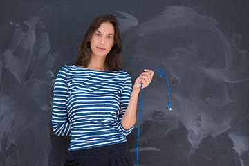 Image showing woman holding a internet cable in front of chalk drawing board