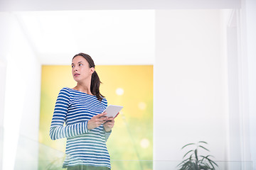 Image showing young woman at home websurfing