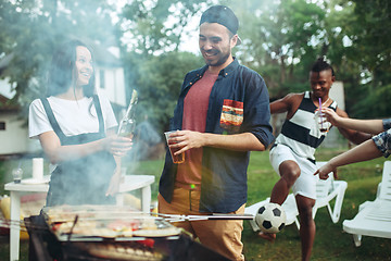 Image showing Group of friends making barbecue in the backyard. concept about good and positive mood with friends