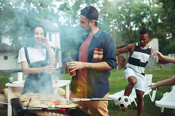 Image showing Group of friends making barbecue in the backyard. concept about good and positive mood with friends