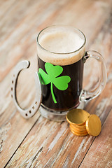 Image showing shamrock on glass of beer, horseshoe and coins