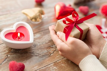 Image showing close up of hands holding christmas gift