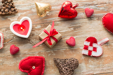 Image showing christmas gift, heart shaped decorations, candle