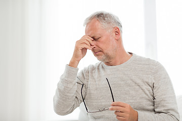 Image showing senior man with having headache