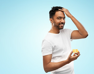 Image showing indian man applying hair wax or styling gel