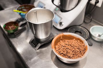 Image showing chocolate buttons in bowl at confectionery shop