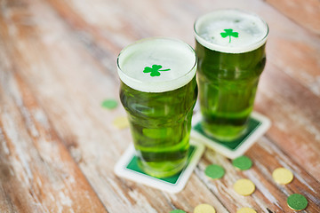 Image showing glasses of green beer with shamrock and gold coins