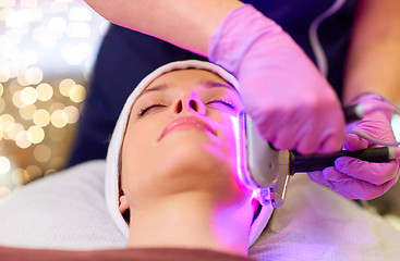 Image showing young woman having face microdermabrasion at spa