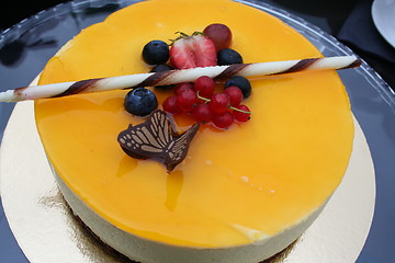 Image showing Cake with decoration of chocolate and berries