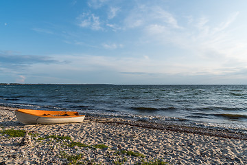Image showing Colorful rowing boat landed on the beach