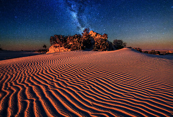 Image showing Sand dunes under starry night sky