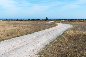 Image showing Winding gravel road in a barren landscape