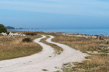 Image showing Winding gravel road along the coast