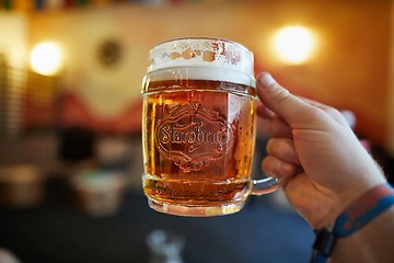 Image showing Holding a glass of Czech beer