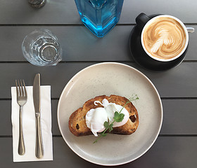 Image showing Poached eggs on toast with coffee