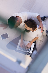 Image showing couple using tablet and laptop computers top view