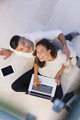 Image showing couple using tablet and laptop computers top view