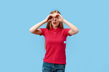 Image showing The young beautiful woman looking into the distance