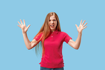 Image showing The young emotional angry and scared woman standing and looking at camera