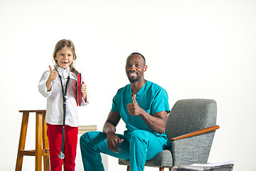 Image showing healthcare and medical concept - doctor and girl with stethoscope in hospital