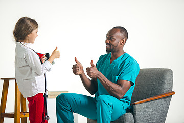 Image showing healthcare and medical concept - doctor and girl with stethoscope in hospital