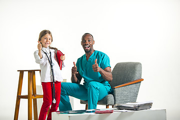 Image showing healthcare and medical concept - doctor and girl with stethoscope in hospital