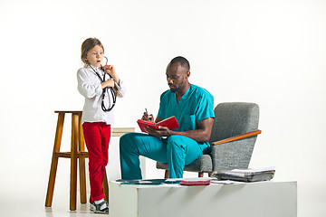 Image showing healthcare and medical concept - doctor and girl with stethoscope in hospital