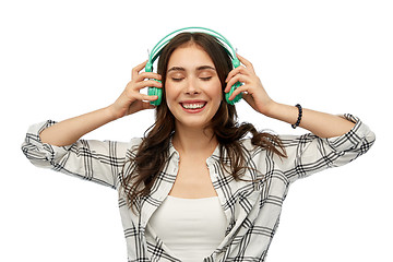 Image showing happy young woman or teenage girl with headphones