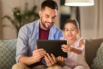 Image showing father and daughter with tablet computer at home