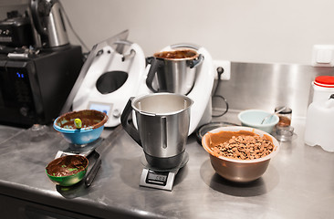 Image showing chocolate buttons in bowl at confectionery shop