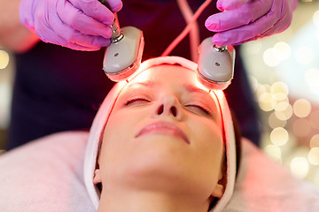 Image showing young woman having face microdermabrasion at spa