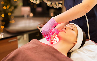 Image showing young woman having face microdermabrasion at spa