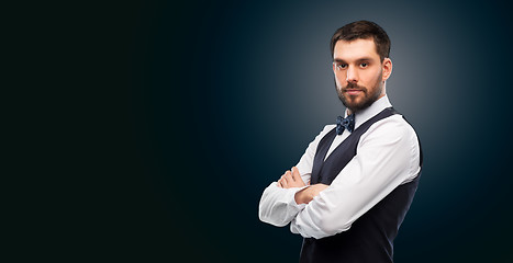 Image showing man in shirt and bowtie over black background