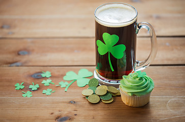 Image showing shamrock on glass of beer, green cupcake and coins