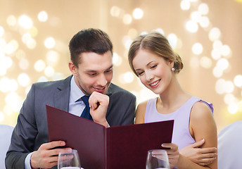 Image showing couple with menu at restaurant